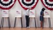 Video: Senior man completing ballot at voting booth and showing completed ballot to camera Senior man completing ballot at voting booth and showing completed ballot to camera