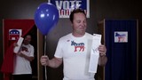 Video: Caucasian man standing in front of voting booth holding balloon and ballot, woman voter exits voting booth popping balloon Caucasian man standing in front of voting booth holding balloon and ballot, woman voter exits voting booth popping balloon