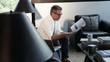 Caucasian man reading paperwork in modern home