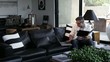 Caucasian man working on laptop in modern home