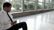 Video: Black businessman using digital tablet in lobby Black businessman using digital tablet in lobby