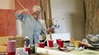 Senior Caucasian woman painting in studio