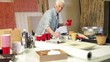 Senior Caucasian woman painting in studio