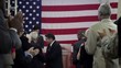 Political candidate on stage addressing crowd