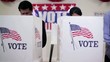 Video: Pan across row of voters voting and polling place Pan across row of voters voting and polling place