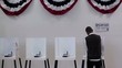Video: Hispanic voter at voting booth completing ballot and walking away Hispanic voter at voting booth completing ballot and walking away