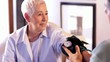 Senior Caucasian woman having blood pressure taken