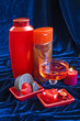 Photo: cosmetic set of red color on a dark background cosmetic set of red color on a dark background