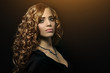 Portrait of a beautiful girl with curly hair