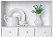 White shelf with vintage porcelain tableware