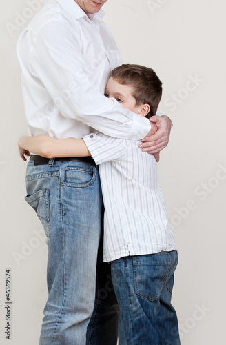 Photo: Father comforts a sad child Father comforts a sad child