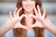 Photo: Young beautiful woman show love sign Young beautiful woman show love sign