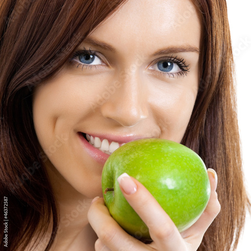 Photo: Cheerful woman eating apple, over white Cheerful woman eating apple, over white