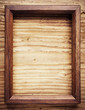 Old wooden frame on wood background