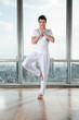 Photo: Young Man Practicing Yoga Young Man Practicing Yoga