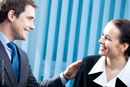Photo: Happy young businesspeople at office Happy young businesspeople at office