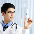 Happy doctor showing bottle of drugs