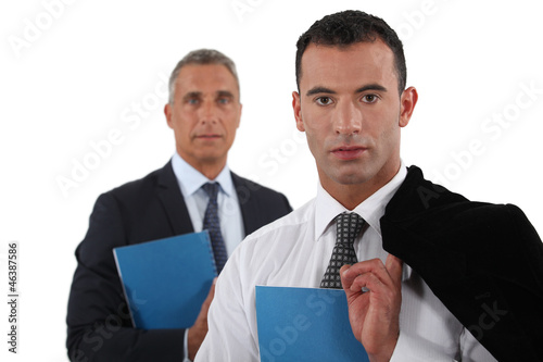 Photo: Young businessman posing with his boss Young businessman posing with his boss