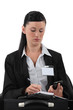 Female reporter wearing visitors badge