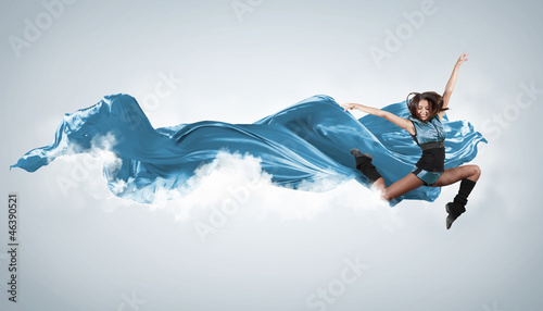 Photo: Young woman dancer. With lights effect. Young woman dancer. With lights effect.