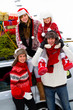 Christmas - family with Christmas tree and gifts on the car