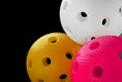 Photo: Three floorball balls isolated on a black background Three floorball balls isolated on a black background