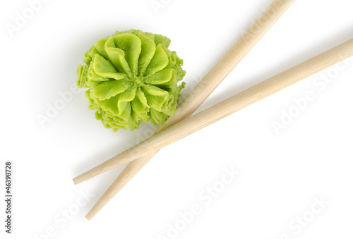 Photo: Wooden chopsticks and wasabi isolated Wooden chopsticks and wasabi isolated