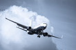 cool toned passenger jet on landing approach