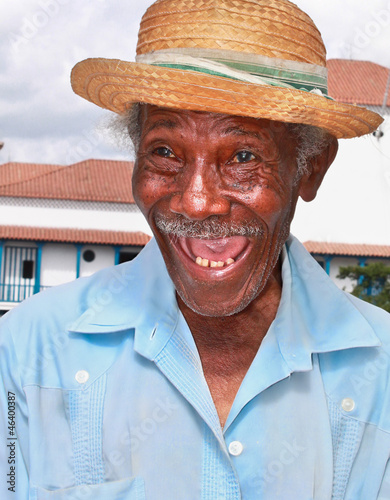 Photo: Old sympathetic cuban man with straw hat make a funny face, Cuba Old sympathetic cuban man with straw hat make a funny face, Cuba