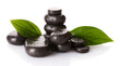 Spa stones with drops and green leaves isolated on white