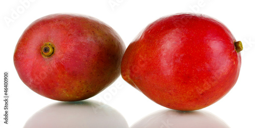 Photo: Ripe appetizing mango isolated on white Ripe appetizing mango isolated on white