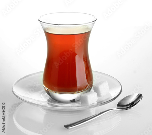 Photo: glass of Turkish tea, isolated on white glass of Turkish tea, isolated on white