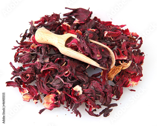 Photo: aromatic Hibiscus tea with wooden shovel, isolated on white aromatic Hibiscus tea with wooden shovel, isolated on white