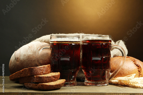Photo: tankards of kvass and rye breads with ears, tankards of kvass and rye breads with ears,