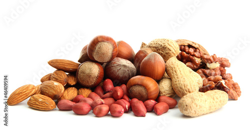 Photo: assortment of tasty nuts, isolated on white assortment of tasty nuts, isolated on white