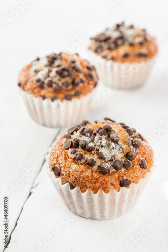 Photo: Chocolate chip muffins on white wood Chocolate chip muffins on white wood