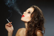 Photo: young brunette woman with cigarette young brunette woman with cigarette