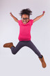 Portrait of Young African American girl jumping