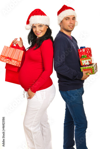 Photo: Happy couple holding Xmas gifts Happy couple holding Xmas gifts