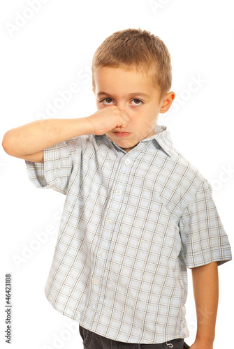 Photo: Boy holding his nose Boy holding his nose