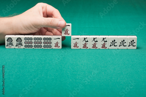 Photo: Smooth table surface with a mahjong on it Smooth table surface with a mahjong on it