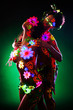 Photo: two sexy women posing in uv light with glow make-up two sexy women posing in uv light with glow make-up