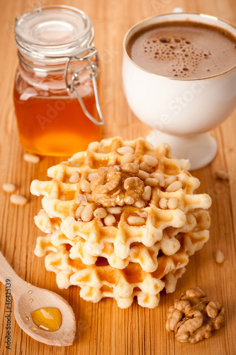 Photo: Healthy breakfast: waffles, nuts, honey and coffee Healthy breakfast: waffles, nuts, honey and coffee