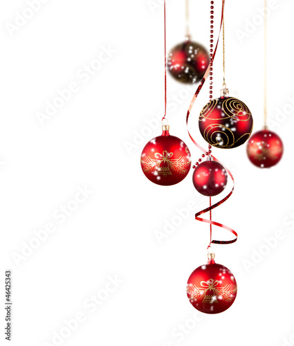 Photo: Bright red Christmas tree balls with curly ribbons isolated on t Bright red Christmas tree balls with curly ribbons isolated on t