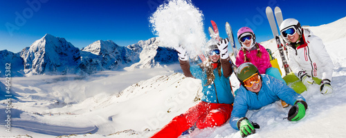 Photo: Ski, snow, sun and winter fun - happy family ski team Ski, snow, sun and winter fun - happy family ski team