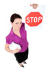 Businesswoman holding a stop sign