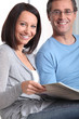 Couple looking at photo album