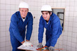 Two men do DIY