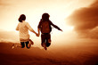 The two girls jump in the sunset