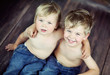 Two little brothers sitting on the floor